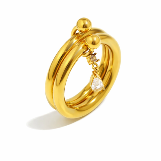 Anillo Doble Dorado Bold con Dije de Zirconia en Gota