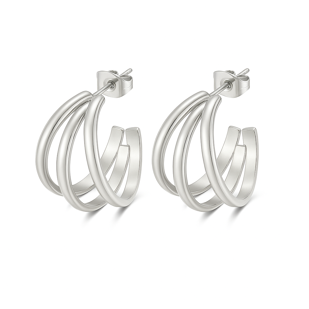 Aretes Nicole – Argollas medianas entrelazadas en dorado y plateado elegante.